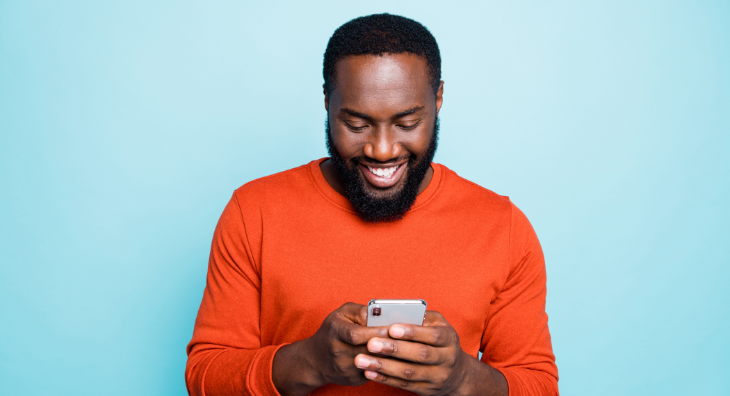 man laughing on his phone