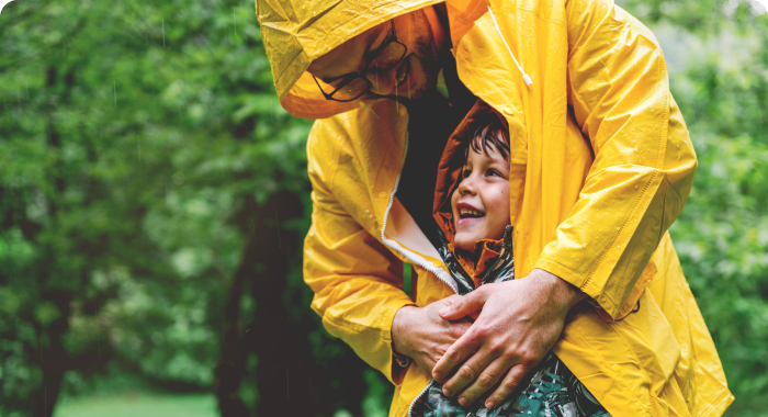 woman and boy yello jacket rain